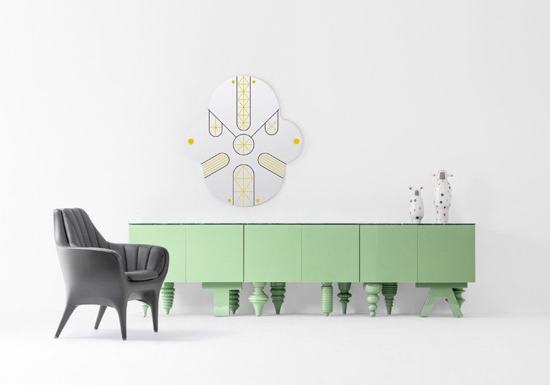 Furniture with front pressure drawers made of flamed wood base in a green tone on a white background