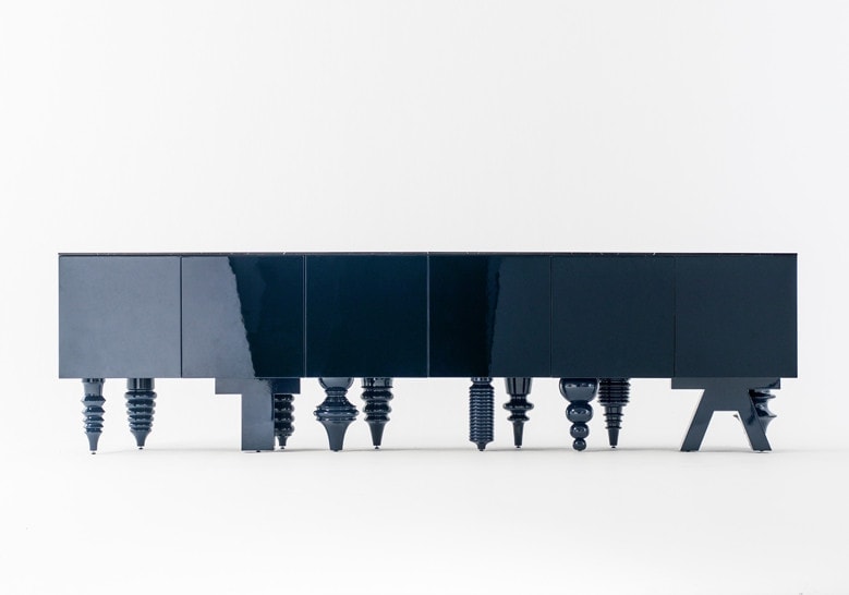 shelf made of wooden base in a black color tone legs in particular design on a white background