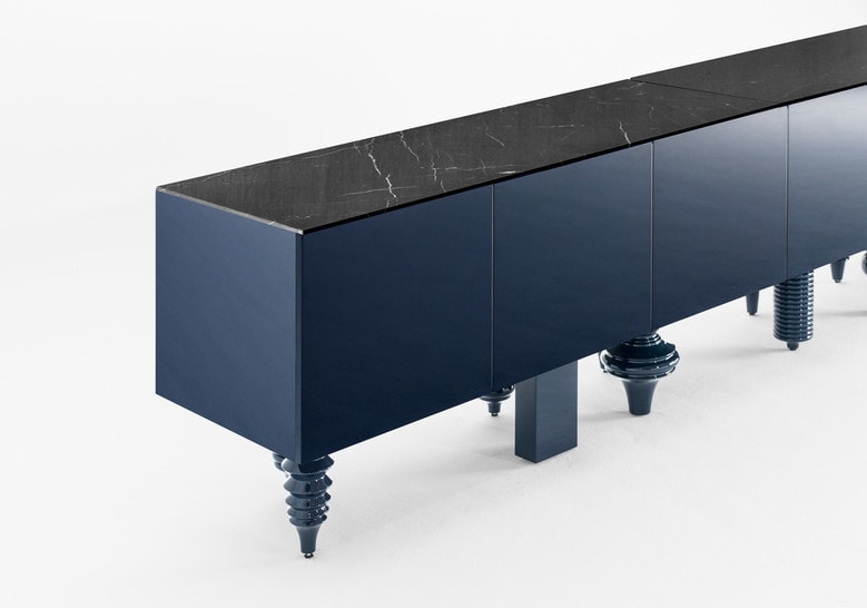 furniture made with legs designed in different styles made of flamed wood in a black tone