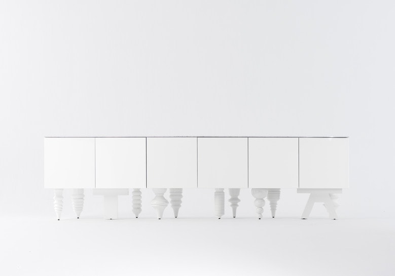 Furniture with front pressure drawers made of flamed wood base in a white color tone on a white background