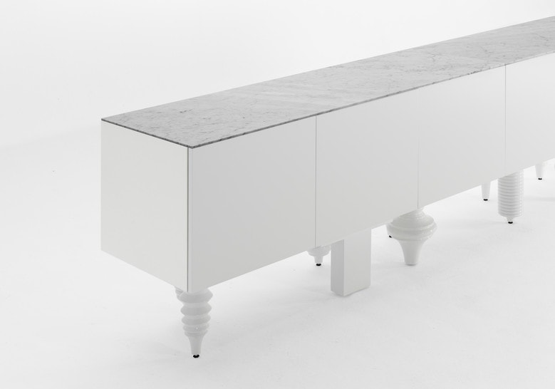 furniture made with legs designed in different styles made of flamed wood in a white tone