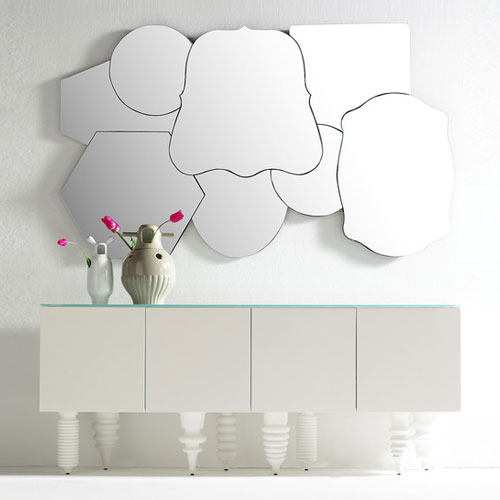 shelf made of wooden base in a tone of white legs in particular design