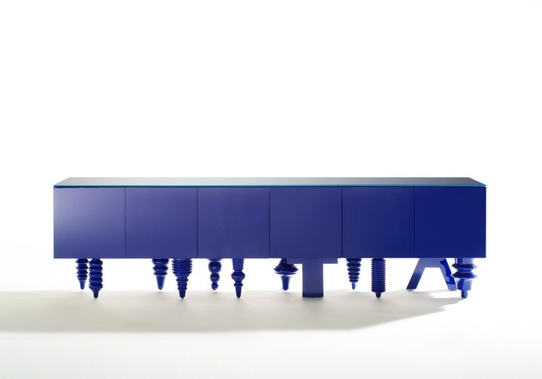 furniture made with legs designed in different styles made of flamed wood in a purple tone