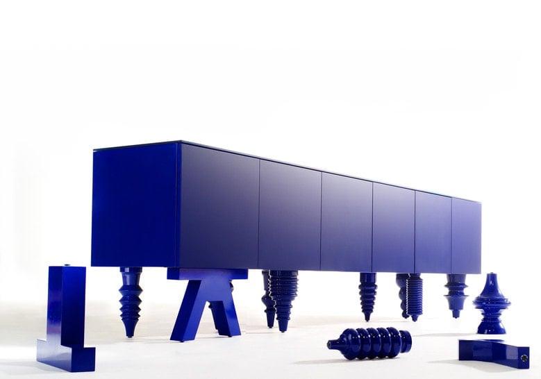 furniture made with legs designed in different styles made of flamed wood in a purple tone on a white background
