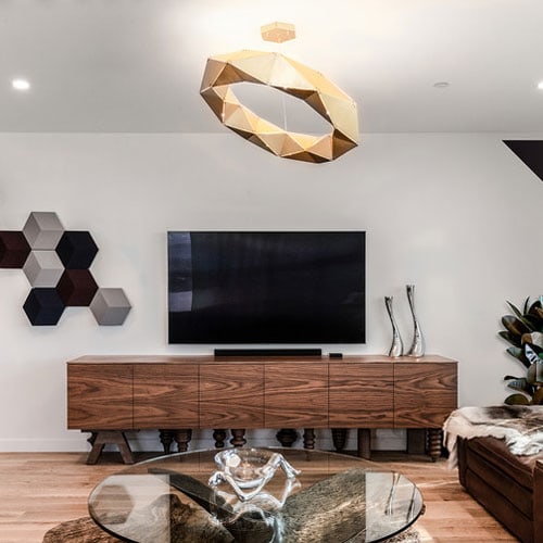 furniture with front pressure drawers made of flamed wood base in a brown tone in a star room