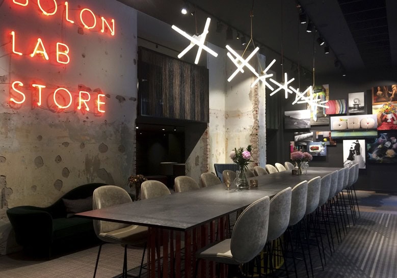 line of hanging lamps made in the shape of a snowflake made of steel in a golden tone