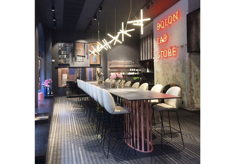 line of hanging lamps made in the shape of a snowflake made of steel in a golden tone