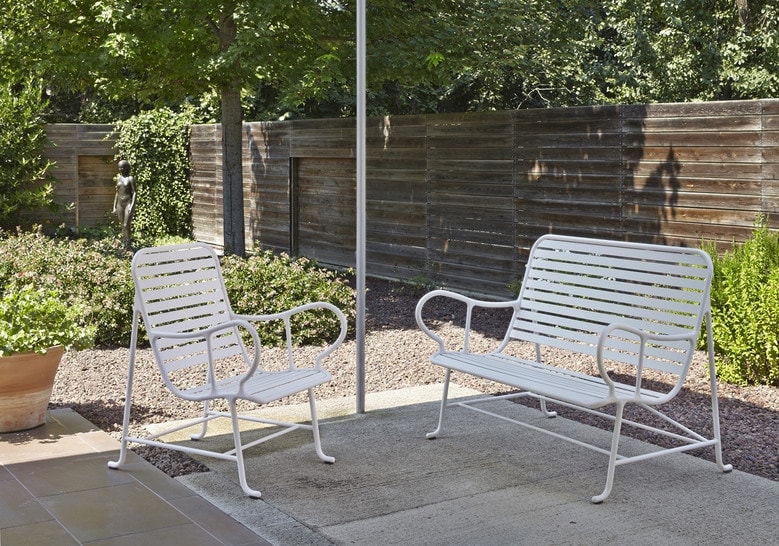 two bench chairs of different sizes in a white tone made of cast aluminum