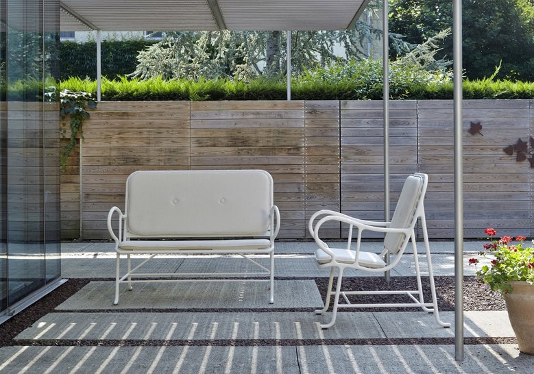 two bench chairs of different sizes in a white tone made of cast aluminum with waterproof fabric cushions