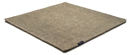 Handmade rug made of fine wool and fabrics in a dark beige tone on a white background