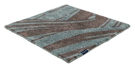 rug made of fabric and handwoven in a zebra design in a blue and brown color tone