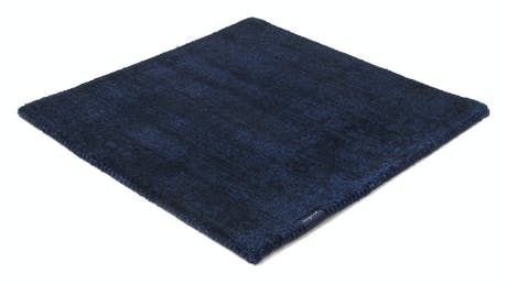 braided and hand-woven rug in wool and velvet in a royal blue color tone