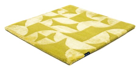 Handmade velvet rug in shades of yellow with patch finishes of the same light color