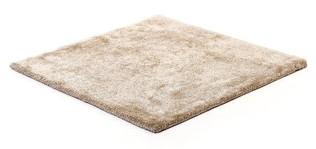 braided and hand-woven rug in wool and velvet in a light beige color tone