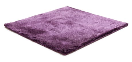 braided and hand-woven rug in wool and velvet in a purple color tone