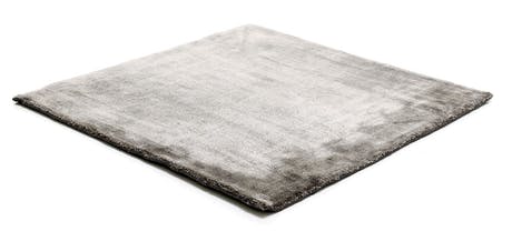 rug made of shiny velvet fabric in a light gray tone