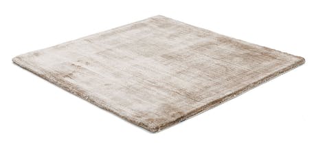 rug made of shiny velvet fabric in a lavender color tone