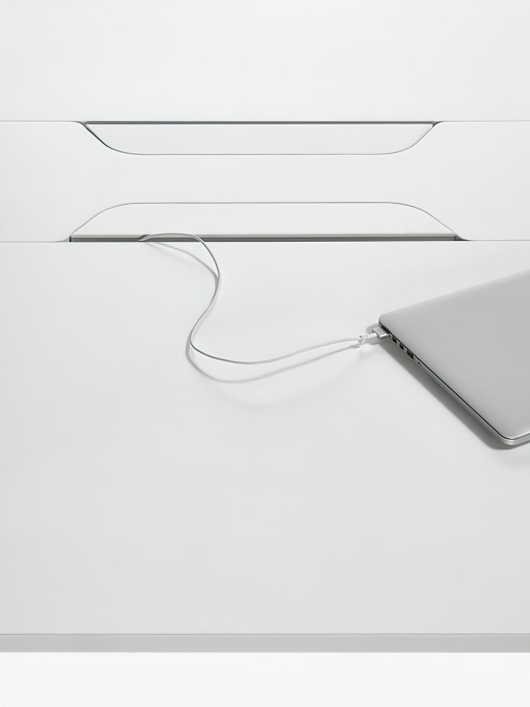work table with small openings in the middle for power connections