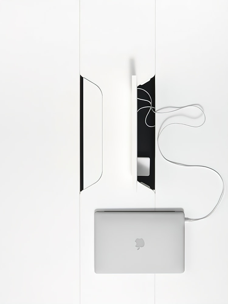 work table with small openings in the middle for power connections