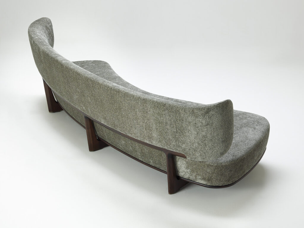 cushion made of fabric in a gray tone on a solid lacquered wood base on a white background