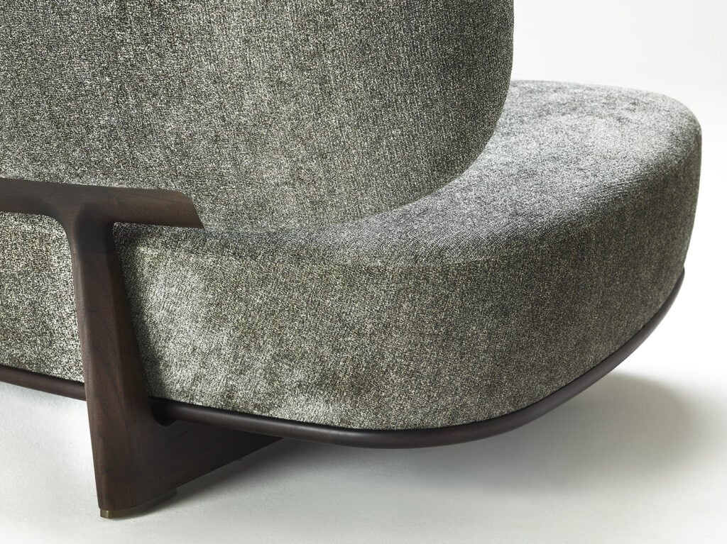 cushion made of fabric in a gray tone on a solid lacquered wood base on a white background