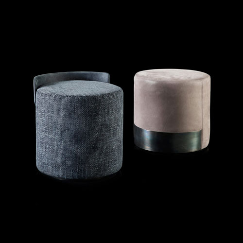 two puffs made of textile or velvet fabric in a shade of pink or blue on a black background