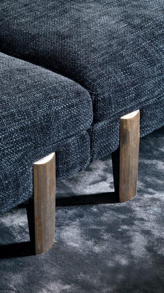 sofa made from steel poatas in a burnished gold tone