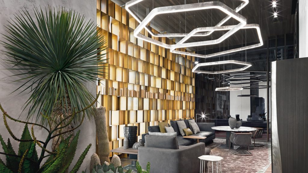 line of polygon-shaped lamps of different sizes in a silver tone