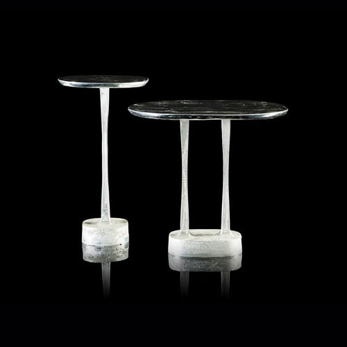 Two round Mushroom Tables. Structure mullion in sandcasting brass and bronze. Finish in silver on a black background.