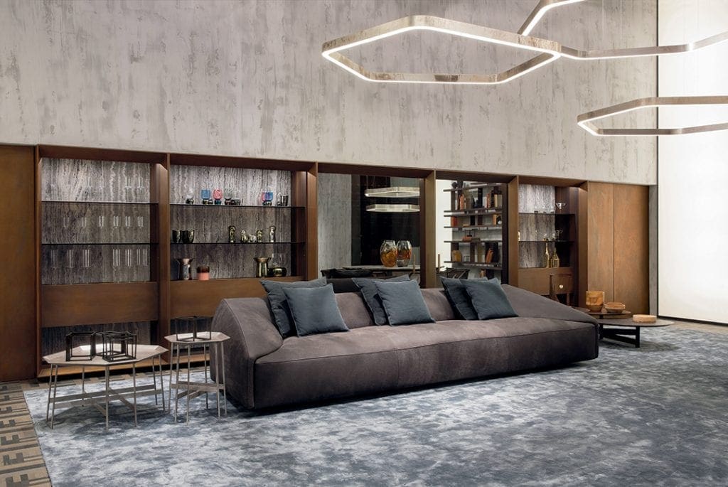Two Octagon Tables, finish structure and eight legs in burnished brass, tabletops in brass in a living room.