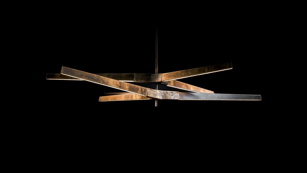 ceiling lamp made of cast brass with a design in geometric lines in a bronze tone in a black background