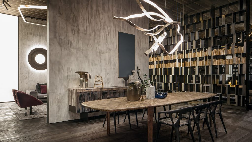 Four led Tape Light with wave shapes creating a dune like pattern using suspension cables. White light and silver structure color in a dining room.