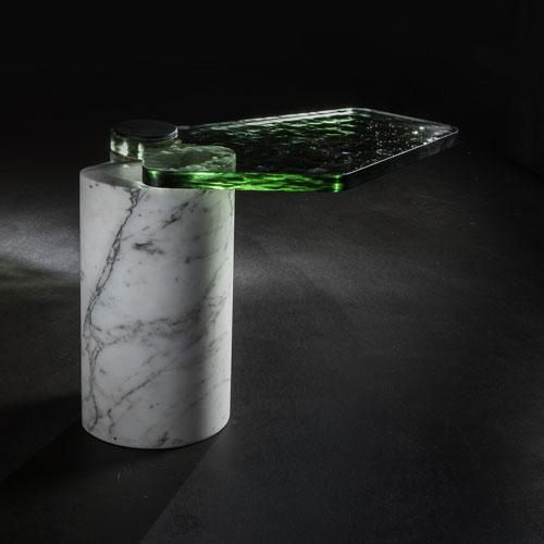 side table made of green fused glass resting on an arabescato stone or rapolano stone base