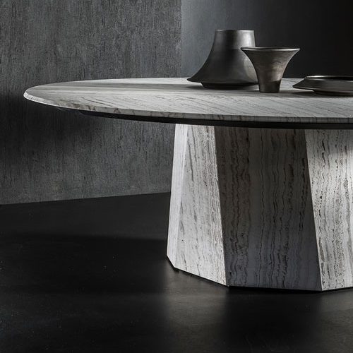 round dining table made in-house in steel covered in gray stone and wooden tops