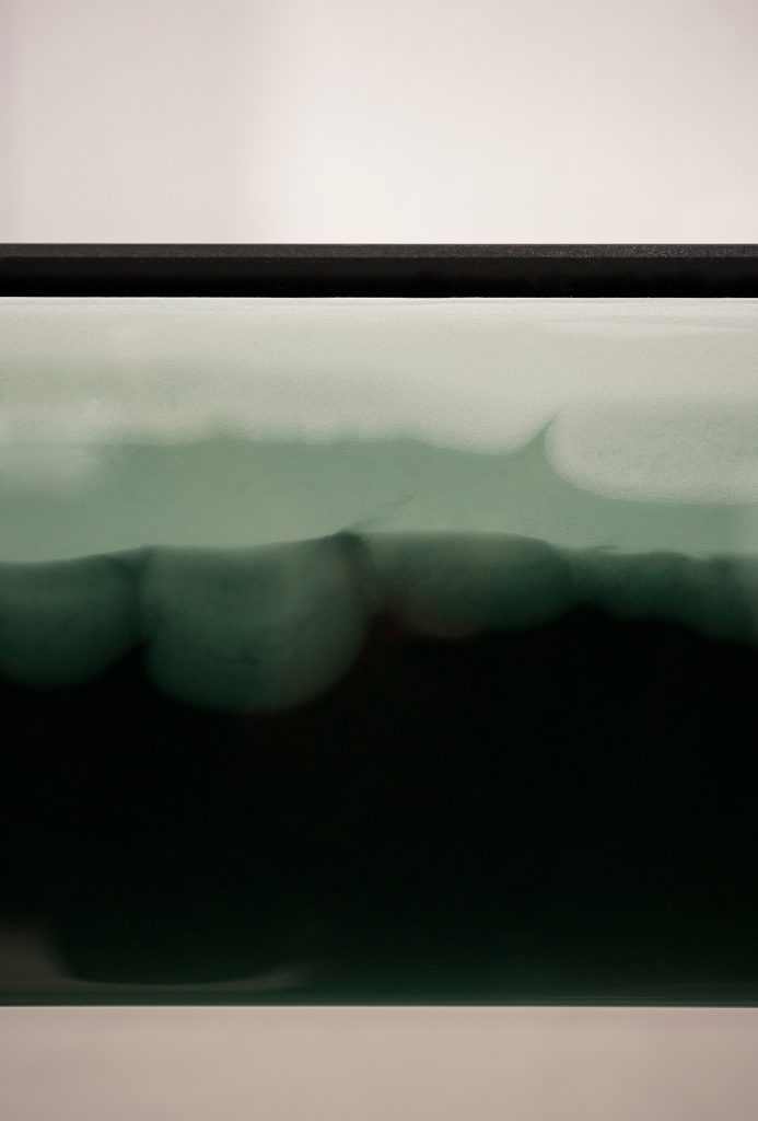 dark green sideboard fading to a lighter one and black finishes