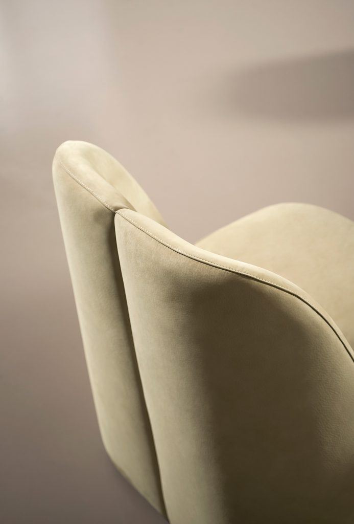 chair made of light brown fabric with division in the middle of its back