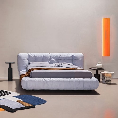 bed made from fabric and textiles with a cloud-shaped design