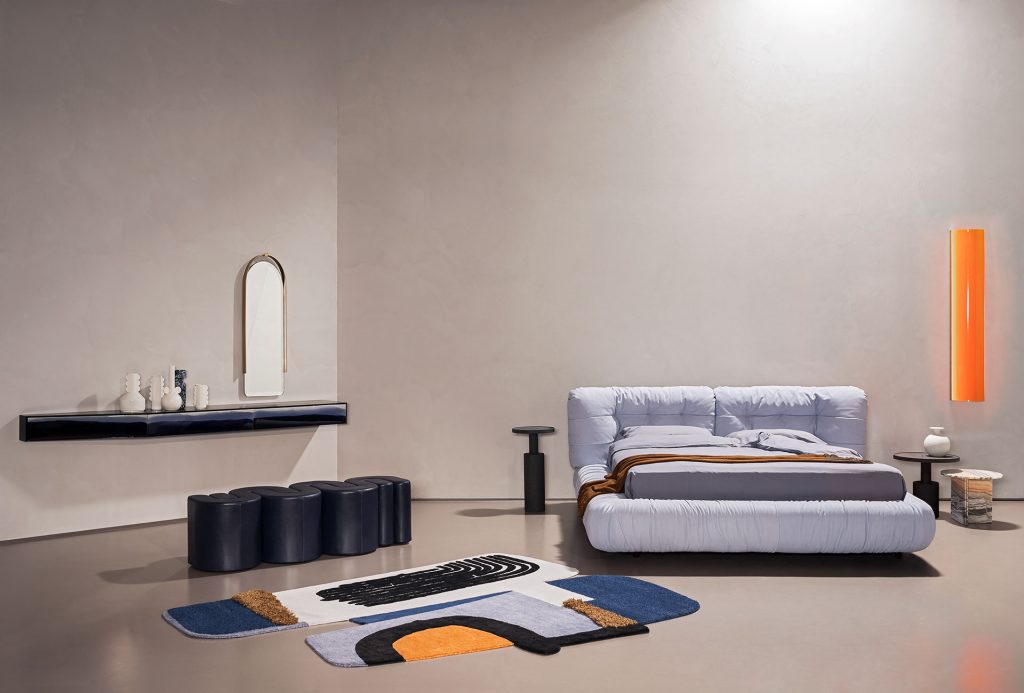 bed made from fabric and textiles with a cloud-shaped design