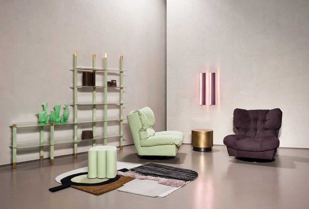 armchair made of leather in a light green tone with button design in a living room
