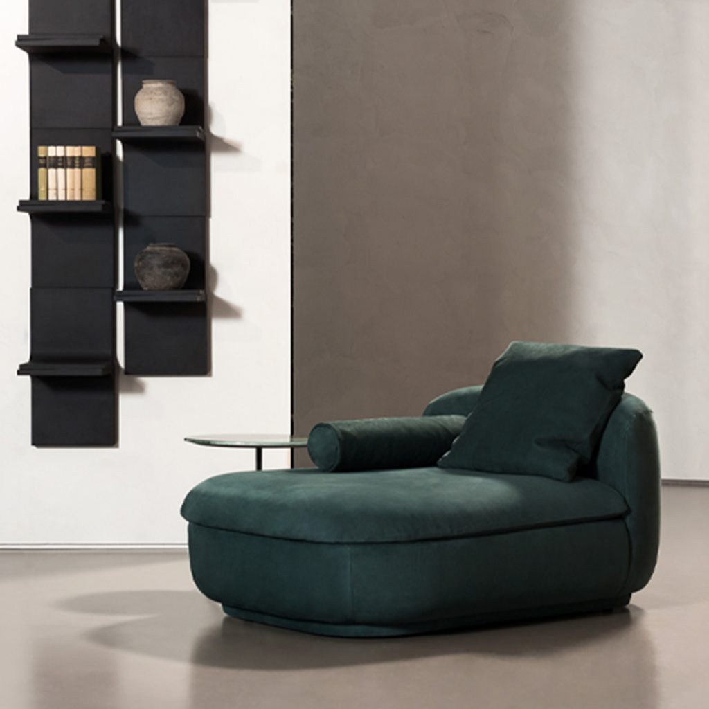 armchair made of fabric in an emerald green tone with suede upholstery