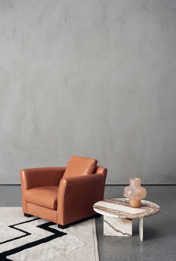 small table in gradient orange marble on a homely background