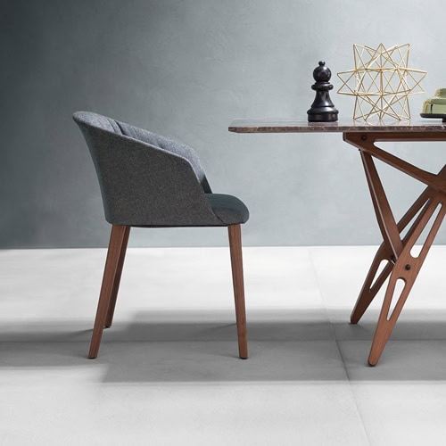 Liza 2271 - 2271R chair featuring a gray cushioned seat, armrest and backrest with four natural wood legs in a dining room.