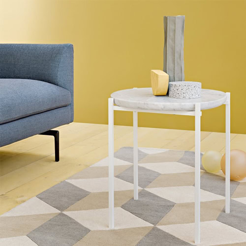 Niobe 648 coffee table with a white and gray round marble top and a white sleek metal frame in a living room.