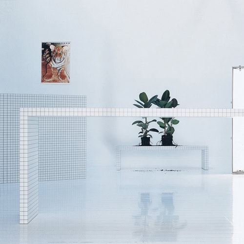 Quaderna 2830 table with a rectangle design, featuring a white grid pattern on all surfaces.
