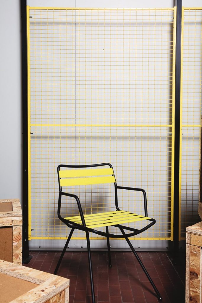 chair made of stainless steel base and its structure made with elastic straps in a yellow tone