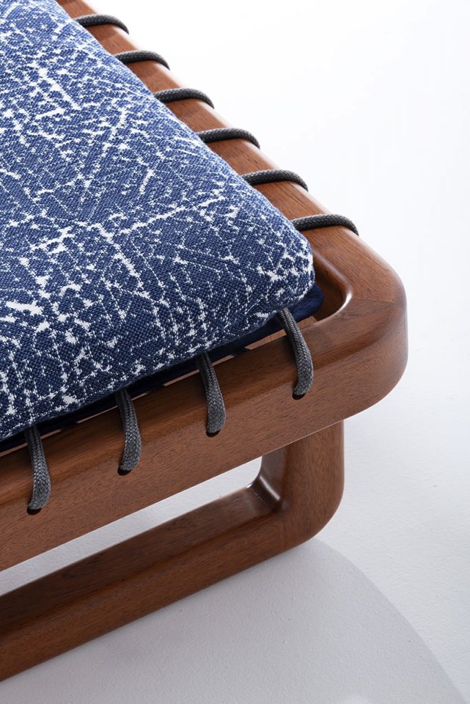 versatile chair with shiny wooden base on a white background