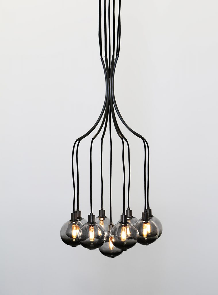 Drape chandelier in black glass and black base on a white background.