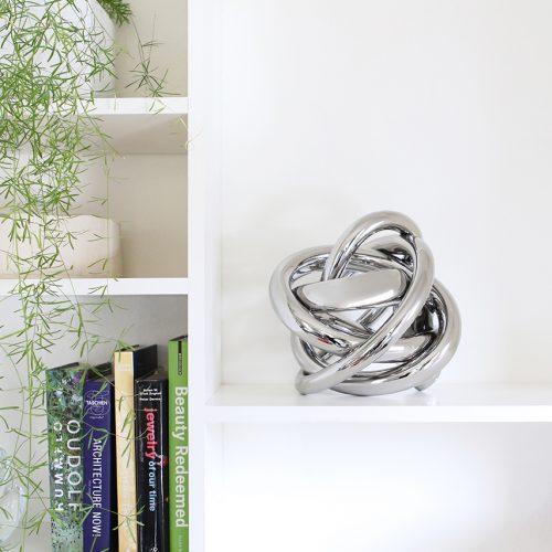 Gray hand blown glass tube with a braided design.