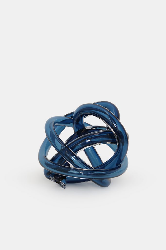 Royal blue hand blown glass pipe with a braided design on a white background.