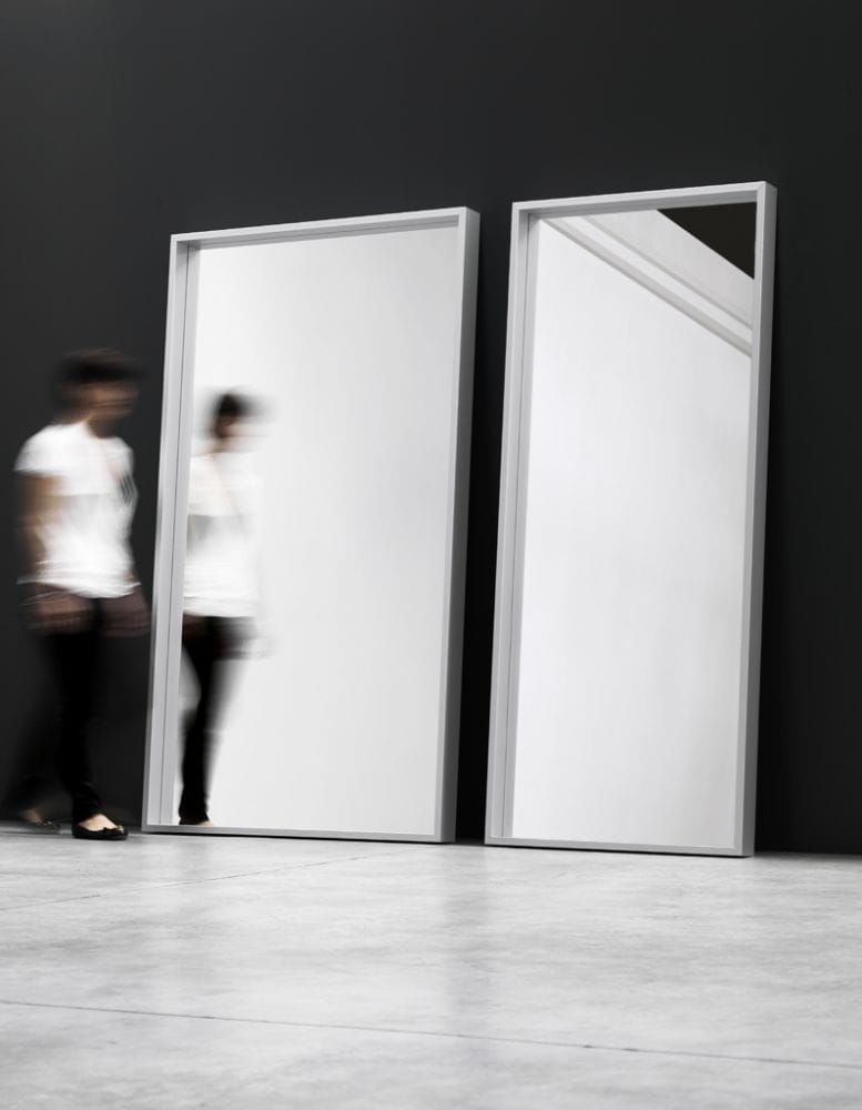 Extra large wall mirror with anodized aluminum frame on an everyday background.